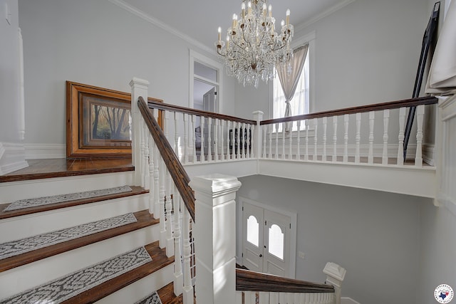 501 Main St, Texarkana, TX 75501 - stairs with a towering ceiling, crown molding, a chandelier, and plenty of natural light