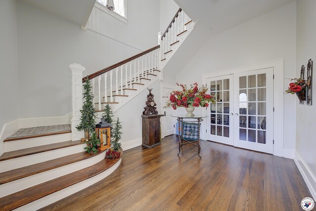501 Main St, Texarkana, TX 75501 - staircase with wood finished floors, baseboards, french doors, and a high ceiling