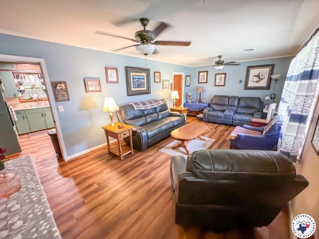 1004 Hillcrest St, Linden, TX 75563 - living area with ceiling fan, light wood-type flooring, ornamental molding, and baseboards