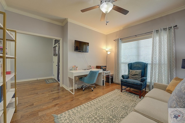 office area with ornamental molding, ceiling fan, and hardwood / wood-style floors