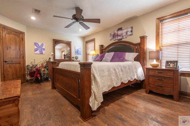 bedroom with ceiling fan and dark hardwood / wood-style flooring