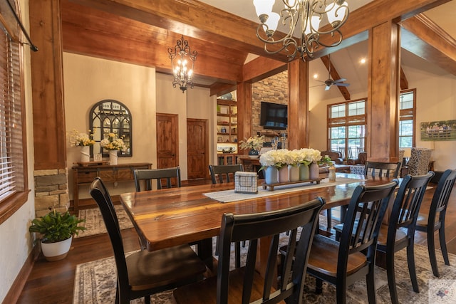 dining space featuring ceiling fan with notable chandelier, dark hardwood / wood-style floors, and beamed ceiling