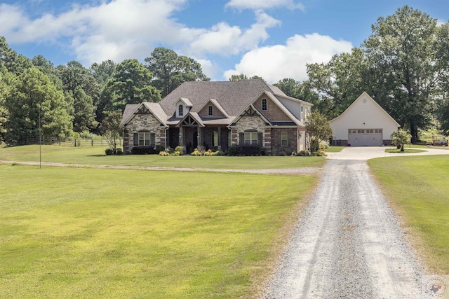 craftsman-style home featuring a front yard and a garage