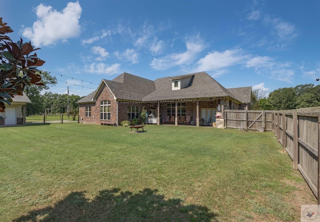 back of house featuring a yard