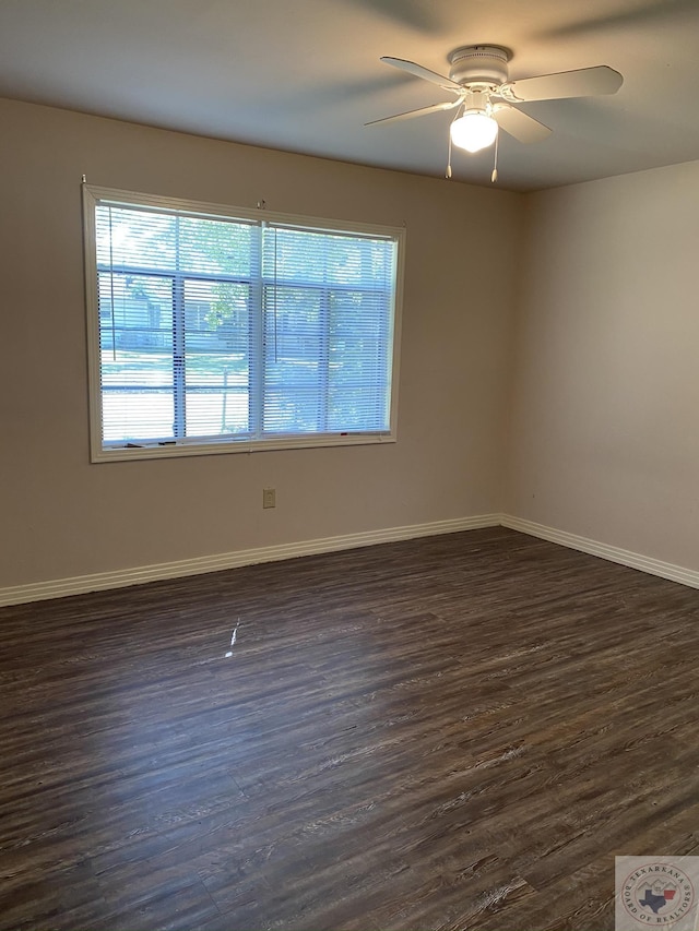 unfurnished room featuring ceiling fan and dark hardwood / wood-style flooring