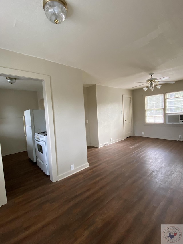 spare room featuring ceiling fan and dark hardwood / wood-style flooring