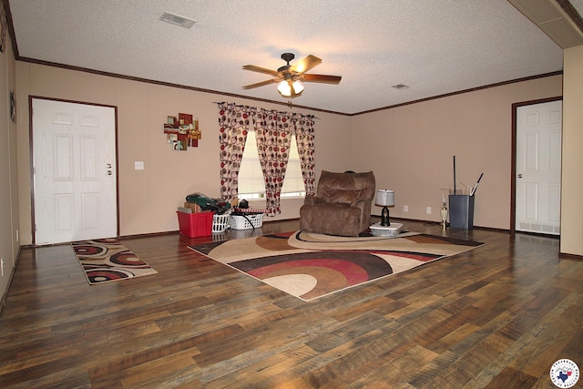 632 White Oak Rd, Maud, TX 75567 - living area featuring wood finished floors, ornamental molding, ceiling fan, and a textured ceiling