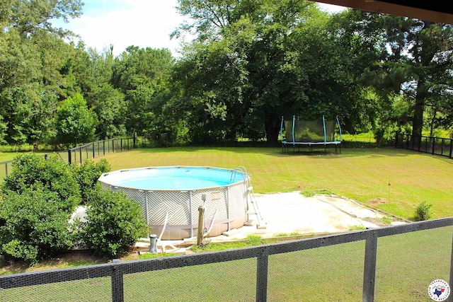 632 White Oak Rd, Maud, TX 75567 - outdoor pool with a trampoline, a fenced backyard, and a patio