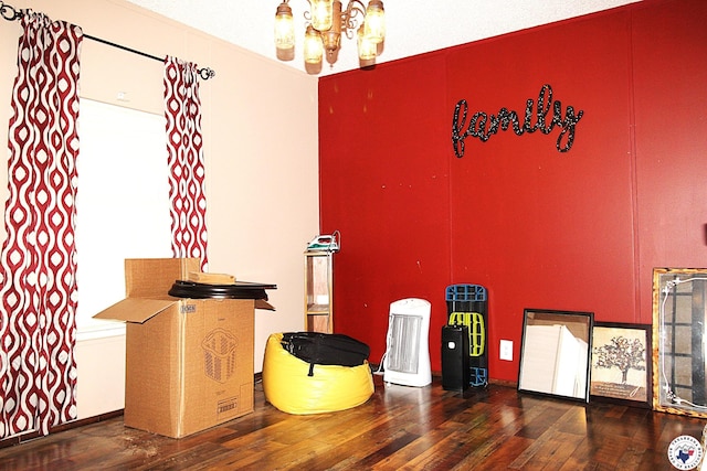 632 White Oak Rd, Maud, TX 75567 - misc room with a chandelier and wood-type flooring