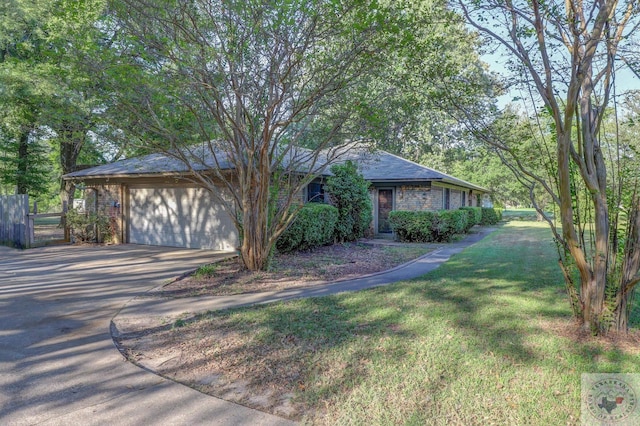 ranch-style home featuring a garage