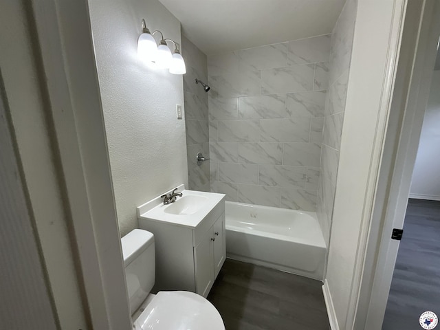 219 Fm 1968, Jefferson, TX 75657 - full bath featuring toilet, vanity, wood finished floors,  shower combination, and a textured wall