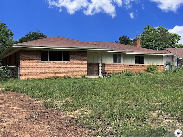 219 Fm 1968, Jefferson, TX 75657 - single story home with brick siding, a chimney, and board and batten siding
