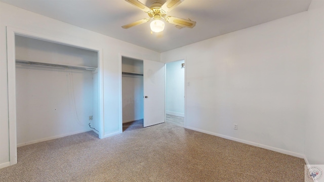 unfurnished bedroom with ceiling fan and carpet