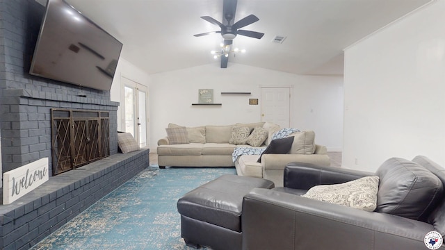 living area with visible vents, vaulted ceiling with beams, a fireplace, and ceiling fan