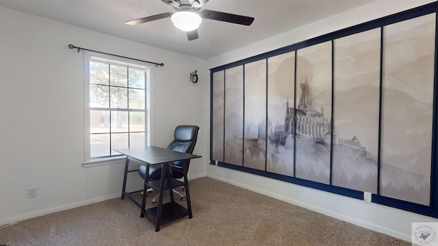 unfurnished office featuring carpet floors and ceiling fan