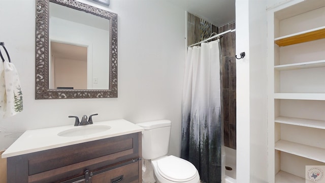 bathroom with tiled shower, toilet, and vanity