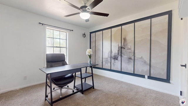 office featuring baseboards, ceiling fan, and carpet floors