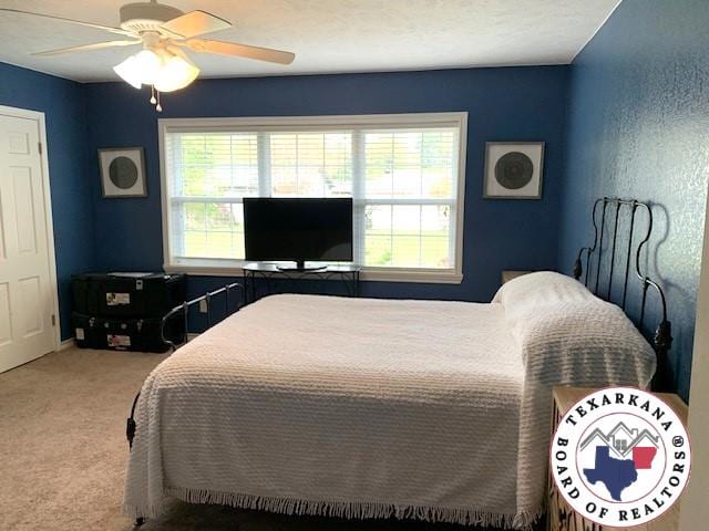 bedroom with carpet flooring and a ceiling fan