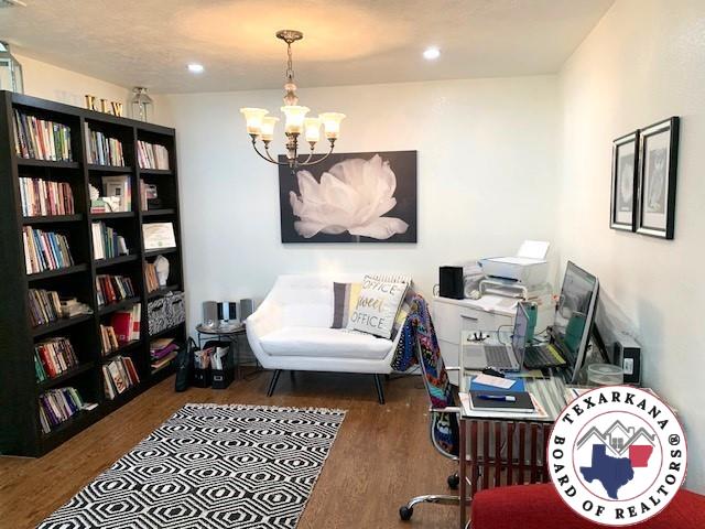 office featuring an inviting chandelier, recessed lighting, and wood finished floors