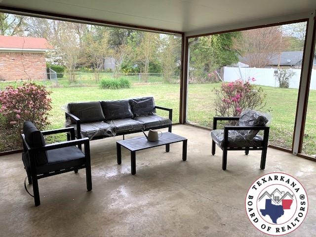 sunroom featuring plenty of natural light and an outdoor living space