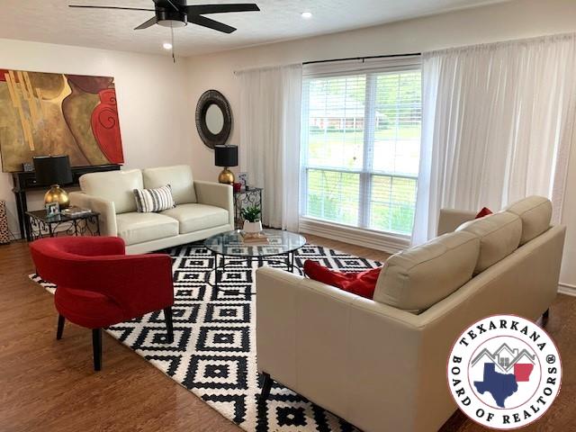living area featuring a ceiling fan, recessed lighting, and wood finished floors