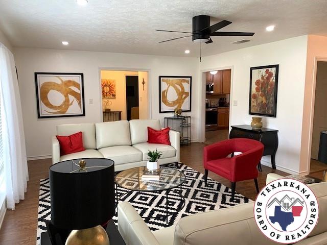living room with baseboards, recessed lighting, a ceiling fan, and wood finished floors