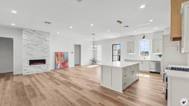 7312 Shadow Brooke, Texarkana, TX 75503 - kitchen featuring stainless steel appliances, open floor plan, light countertops, recessed lighting, and a kitchen island