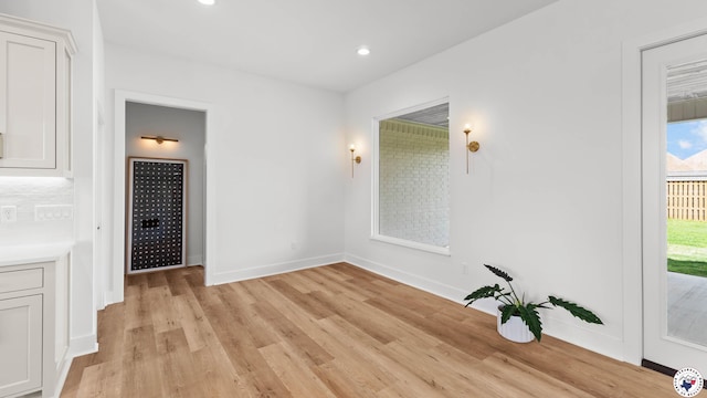 7312 Shadow Brooke, Texarkana, TX 75503 - hallway featuring light wood-style flooring, baseboards, and recessed lighting