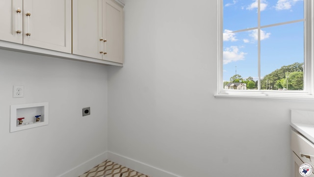 7312 Shadow Brooke, Texarkana, TX 75503 - laundry room featuring cabinet space, hookup for an electric dryer, hookup for a washing machine, and baseboards