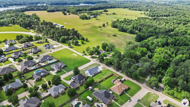 7312 Shadow Brooke, Texarkana, TX 75503 - aerial view of residential area with a nearby body of water and a heavily wooded area