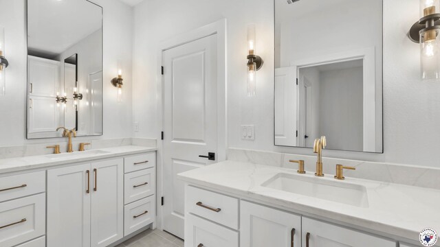 7312 Shadow Brooke, Texarkana, TX 75503 - bathroom with two vanities and tile patterned flooring