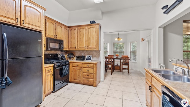 6 Meredith Way, Texarkana, TX 75501 - kitchen with light tile patterned flooring, a sink, light countertops, decorative backsplash, and black appliances