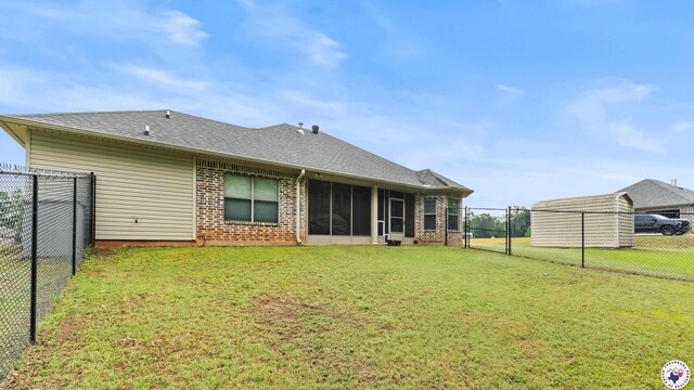 6 Meredith Way, Texarkana, TX 75501 - back of property with a lawn, brick siding, a fenced backyard, and a sunroom