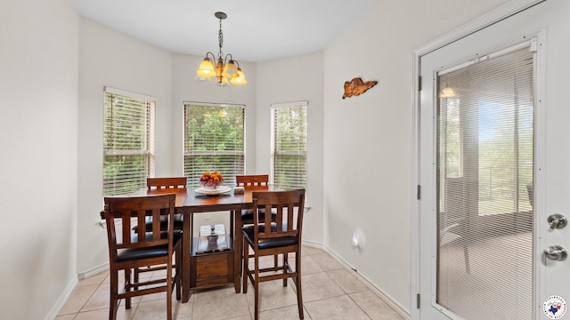 6 Meredith Way, Texarkana, TX 75501 - dining room with baseboards, a notable chandelier, light tile patterned flooring, and a healthy amount of sunlight