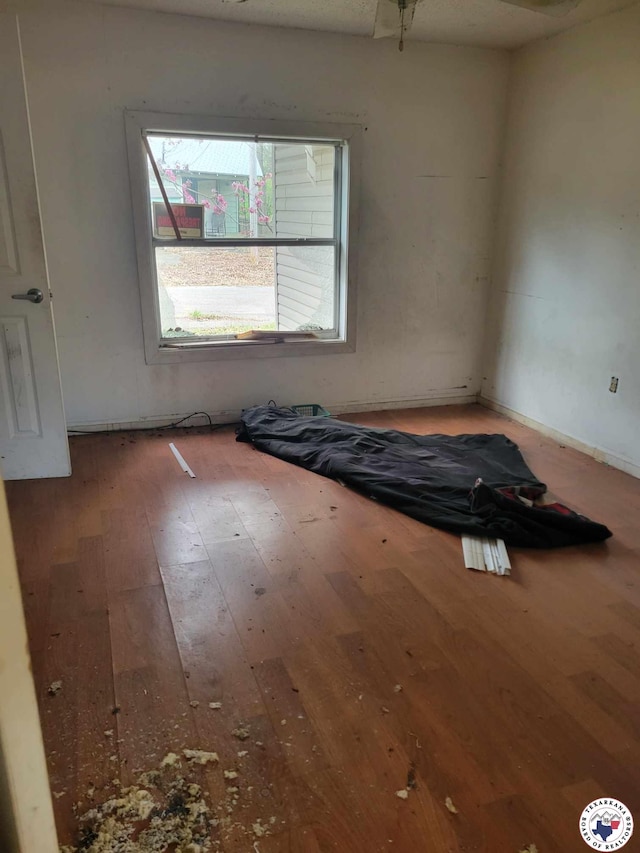 3325 Findley St, Texarkana, TX 75501 - unfurnished bedroom with hardwood / wood-style flooring and baseboards