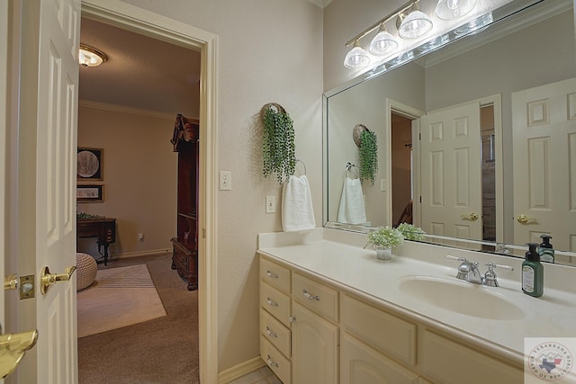 bathroom featuring vanity and crown molding