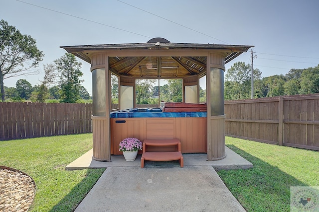 view of patio featuring a gazebo and a hot tub