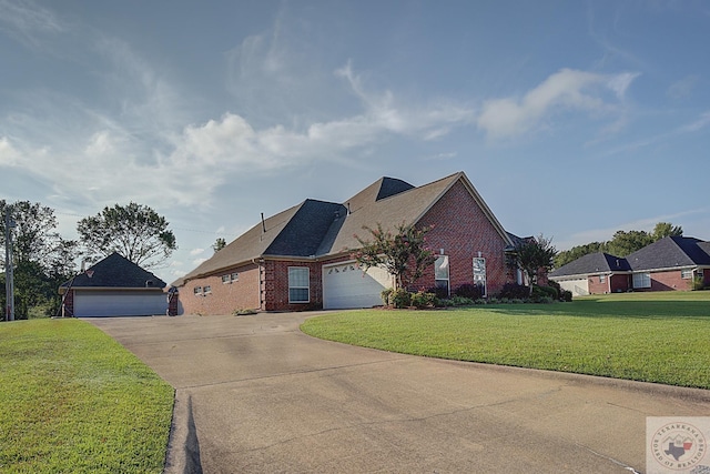 view of front of home with a garage and a front yard