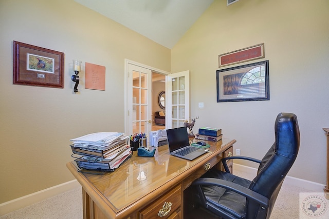 carpeted office space with french doors and vaulted ceiling