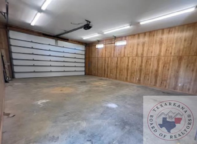 garage featuring wood walls