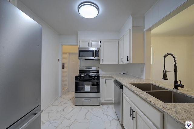 4201 Pine St, Texarkana, TX 75501 - kitchen featuring stainless steel appliances, a sink, light marble finish flooring, light stone counters, and ornamental molding