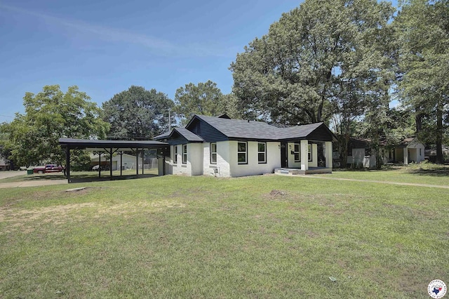 4201 Pine St, Texarkana, TX 75501 - view of front facade featuring a front yard, stucco siding, and a carport