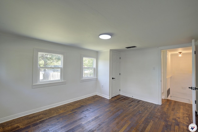 4201 Pine St, Texarkana, TX 75501 - spare room with dark wood-style floors, baseboards, and ornamental molding