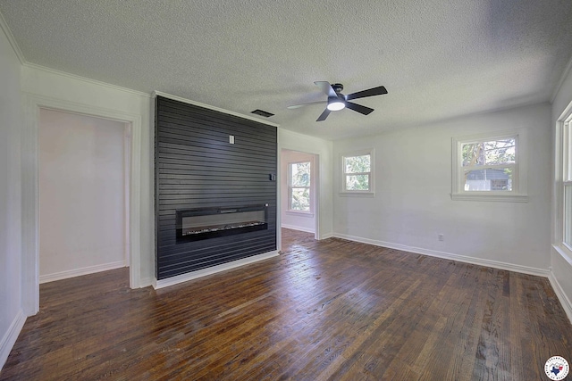 4201 Pine St, Texarkana, TX 75501 - unfurnished living room with a fireplace, a textured ceiling, dark wood-style floors, a ceiling fan, and baseboards