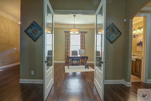 hall featuring french doors, crown molding, and dark hardwood / wood-style floors