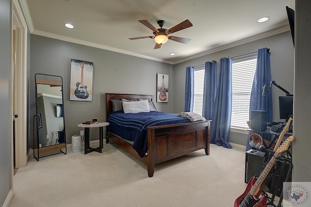 carpeted bedroom with ceiling fan and crown molding