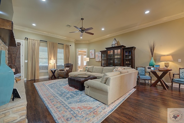 living room with dark hardwood / wood-style floors, ceiling fan, and ornamental molding