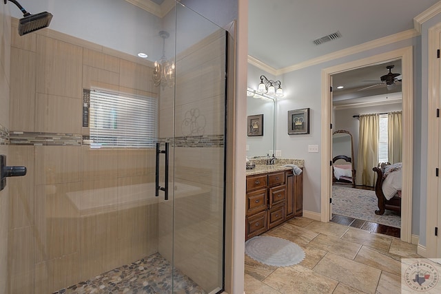 bathroom with vanity, ceiling fan, crown molding, and a shower with door