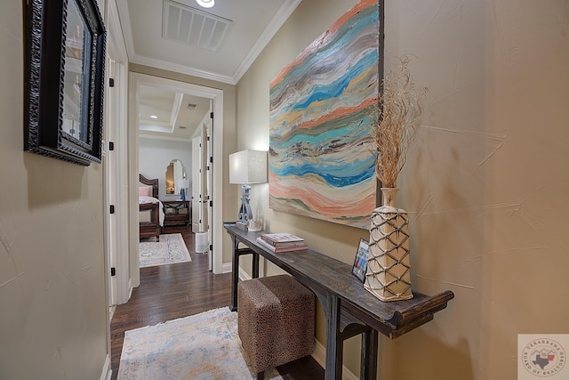 hall featuring crown molding and dark hardwood / wood-style flooring