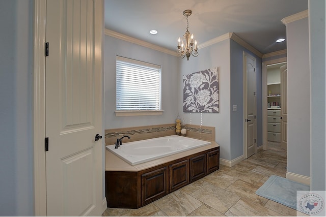 bathroom featuring ornamental molding, a bathing tub, and a notable chandelier